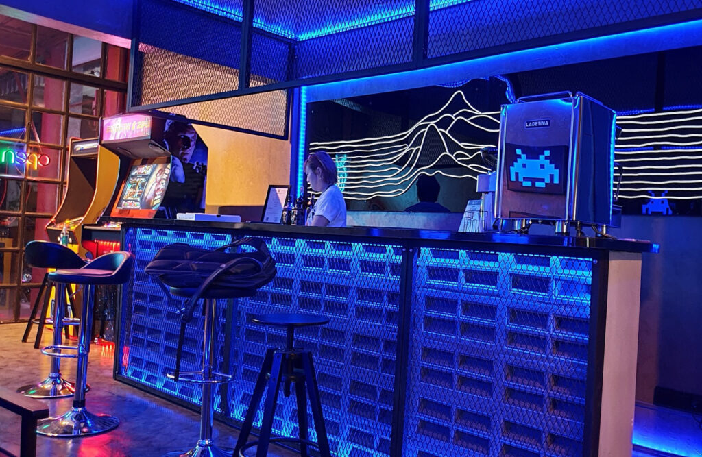 Arcadia barcade has craft beer, kratom and a dispensary with a retro video game arcade, cocktails, boutique hotel, Airbnb rooms, in Bangkok, Thailand.